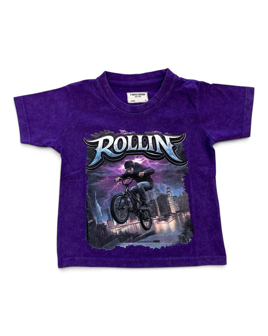 A purple short-sleeve kids' t-shirt featuring a large graphic print of a BMX rider with the word 'ROLLIN'' in stylized lettering, displayed flat against a white background.
