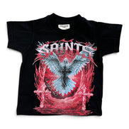 A black short-sleeve graphic t-shirt featuring a large front print with the word 'SAINTS' in stylized white letters above a blue and red angel design with crosses.