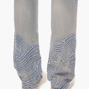 blue jeans with blue wave patterns on a white background