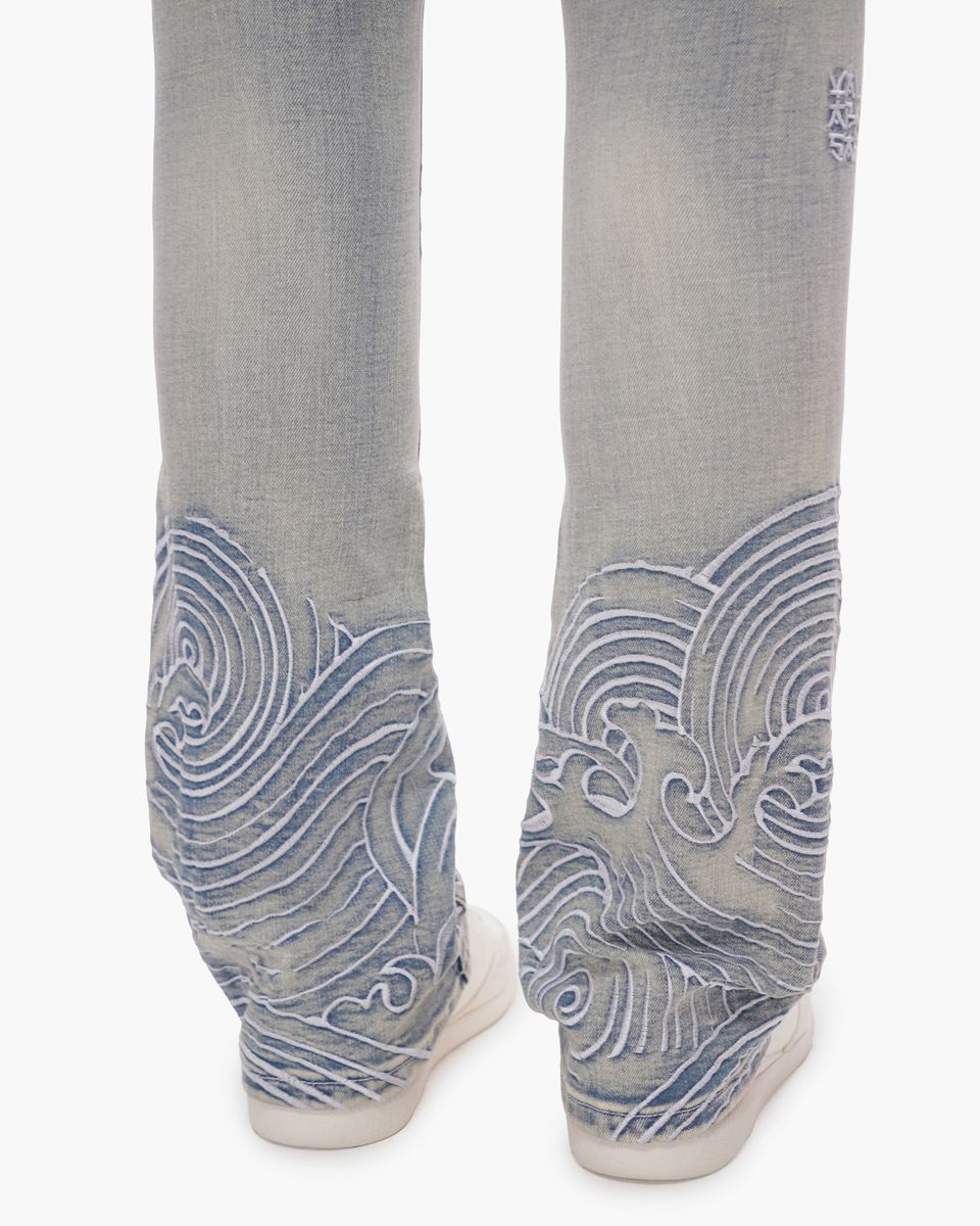 blue jeans with blue wave patterns on a white background