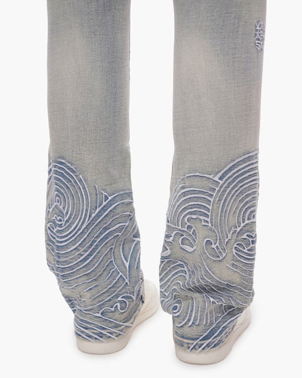 blue jeans with blue wave patterns on a white background