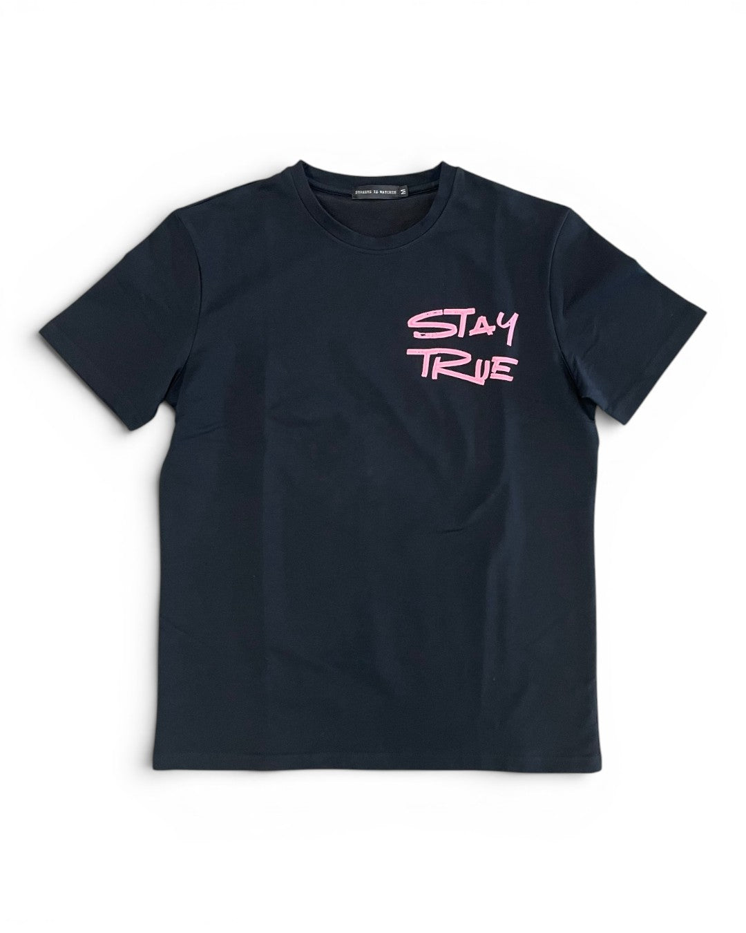 Black t-shirt with pink 'Stay True' text on a white background