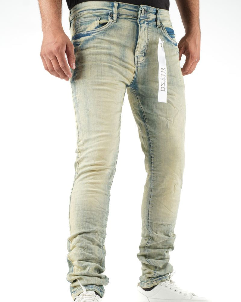 Light blue distressed jeans worn by a person on a white background