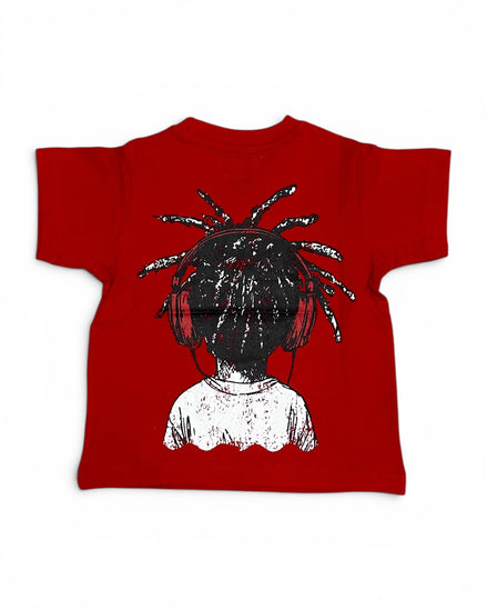 A red short-sleeve t-shirt with a graphic print of a person from behind featuring black dreadlocks and a white top, displayed flat against a white background.
