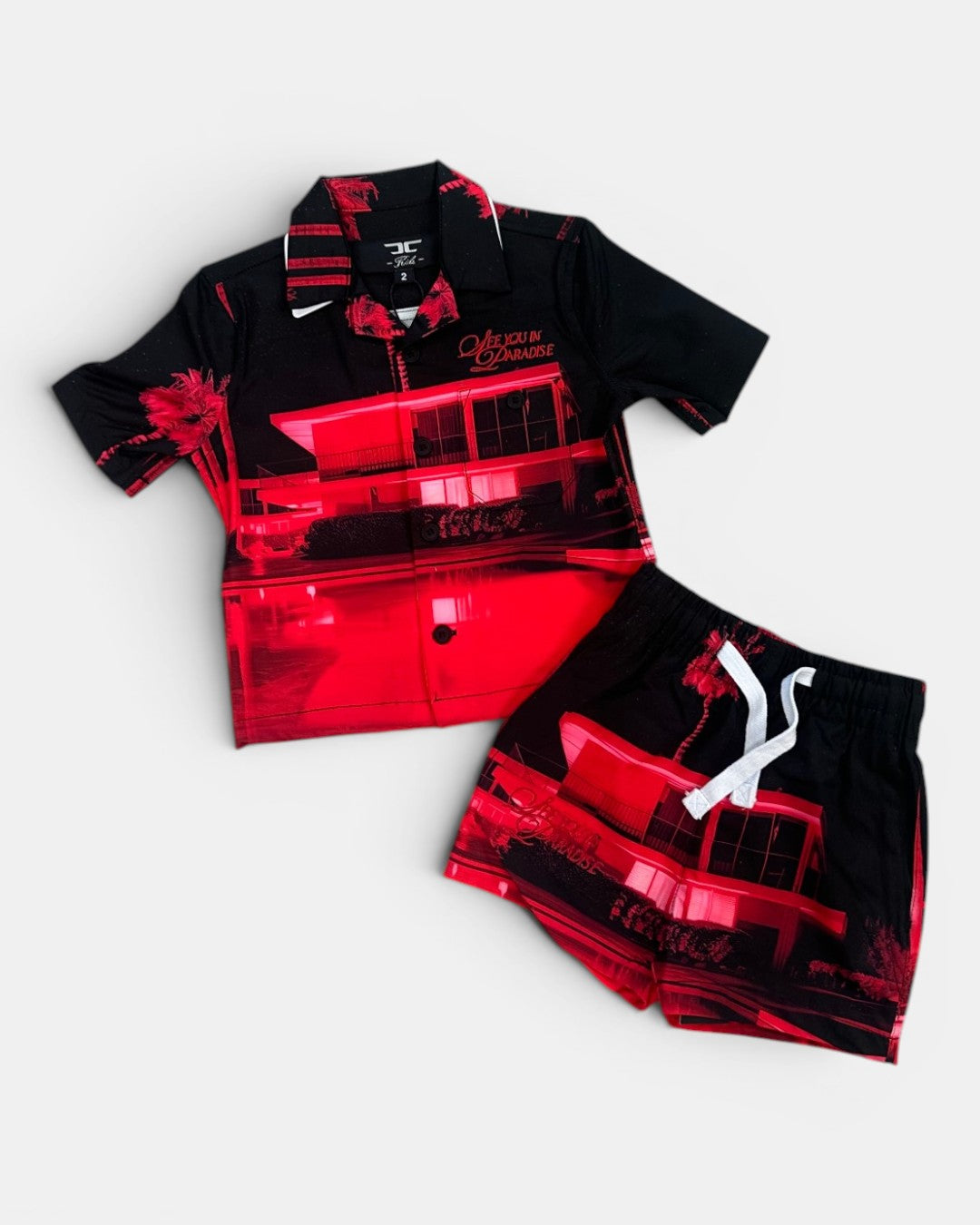 Black and red shirt with matching shorts on a light gray background