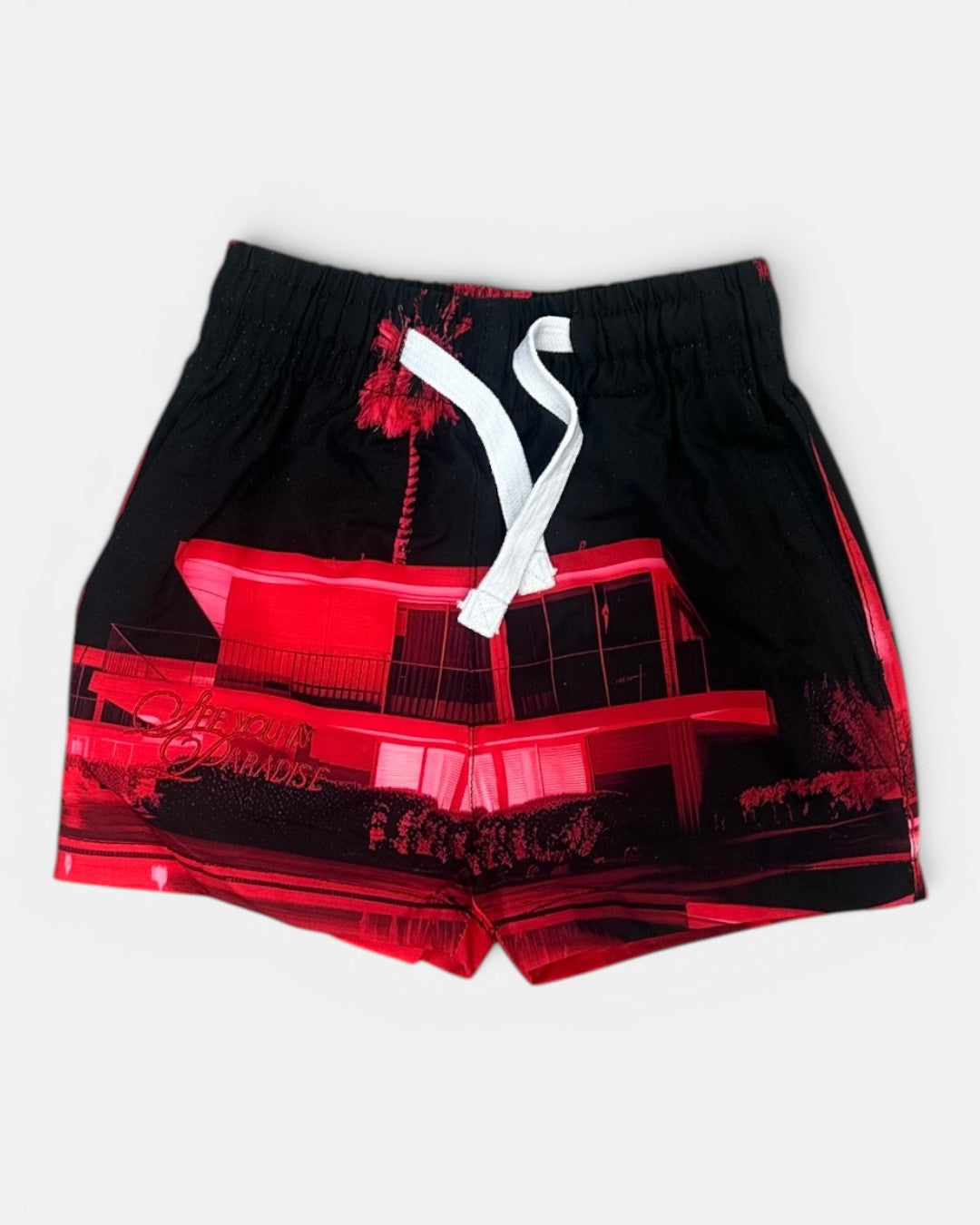 Black shorts with red graphic design on a white background