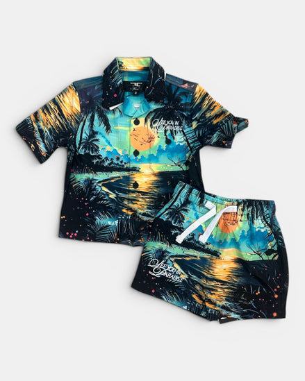 Tropical-themed shirt and shorts set on a white background