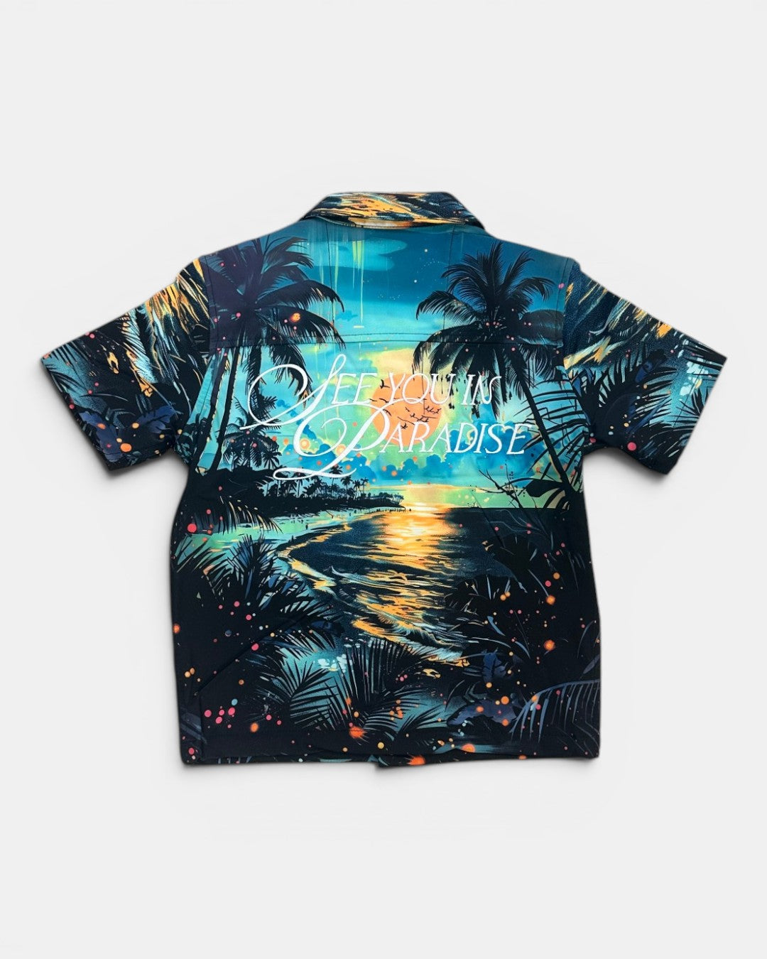 Hawaiian shirt with tropical design and 'Paradise' text on a white background