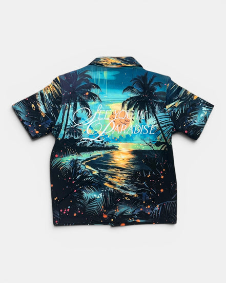 Hawaiian shirt with tropical design and 'Paradise' text on a white background