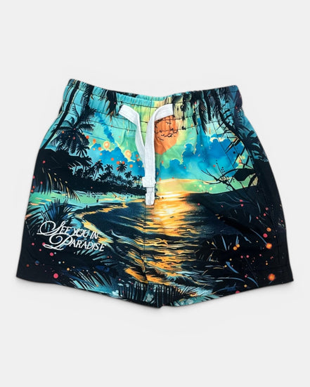 Beach-themed shorts with a sunset design and 'Life is a Paradise' text on a white background