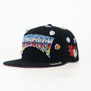 Black cap with colorful text and decorative elements on a white background