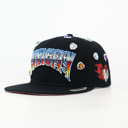 Black cap with colorful text and decorative elements on a white background