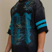 Person wearing a black and blue graphic t-shirt with 'Pierce' branding.