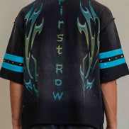 Black t-shirt with blue flame designs and text on a plain background