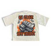 White t-shirt with money design and 'In Cash We Trust' text on a white background