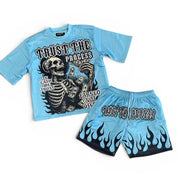 Light blue t-shirt and shorts set with skeleton graphic and text on a white background