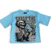 Light blue t-shirt with skeleton design and text on a white background