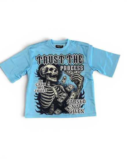 Light blue t-shirt with skeleton design and text on a white background