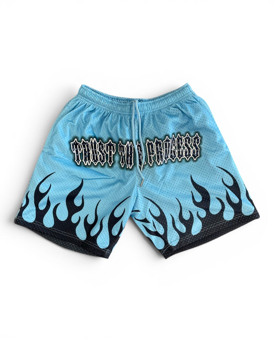 Light blue shorts with black flame patterns and text on a white background