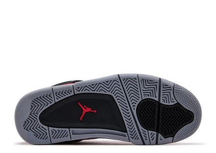 Sole of a sneaker with a red logo on a white background