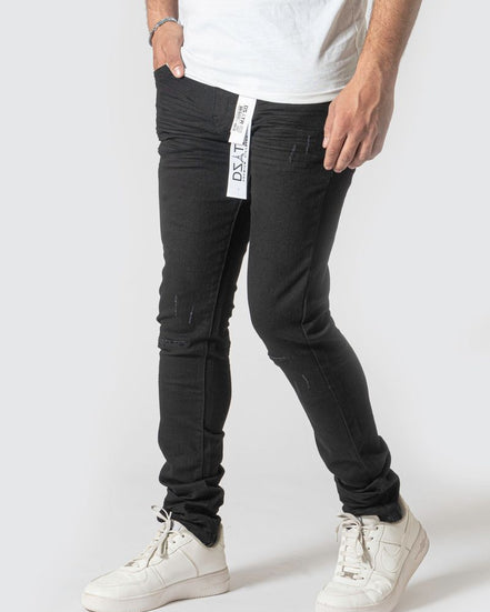 Person wearing black pants with a visible brand logo on a white background