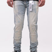 Person wearing light blue distressed jeans with a black shirt on a white background