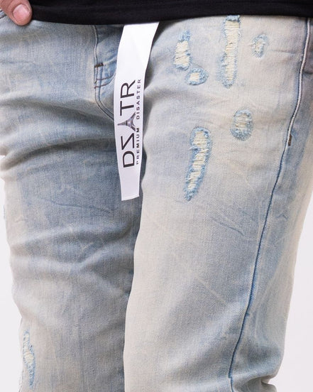 Light blue distressed jeans with a visible brand label on a white background