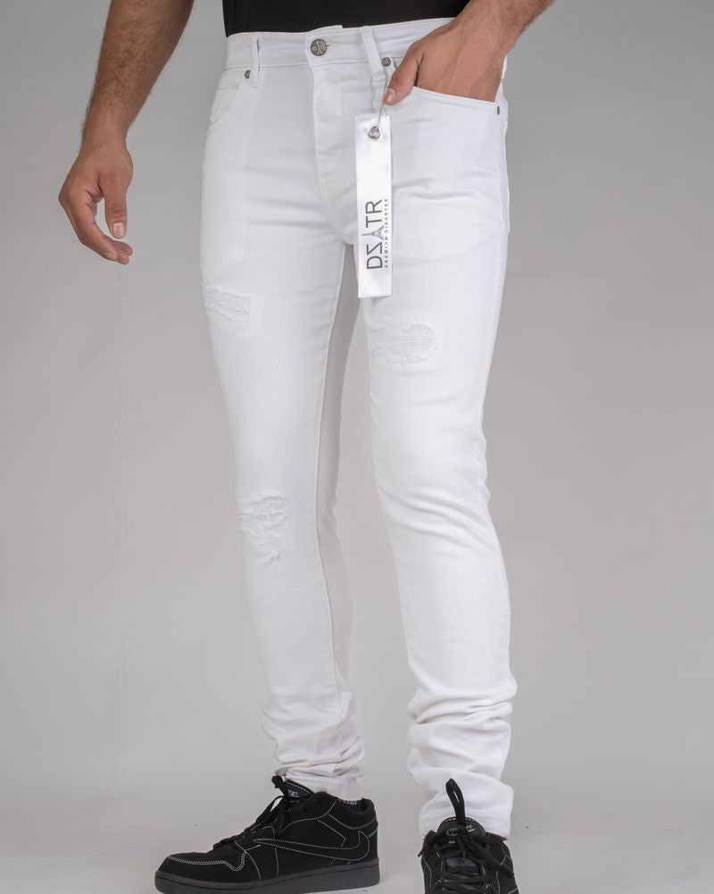 White jeans with a brand tag displayed on a gray background