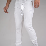 White jeans with a brand tag on a plain background