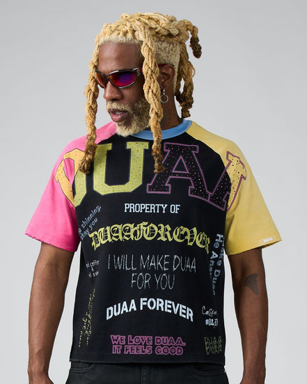 Person wearing a colorful t-shirt with text and graphics on a gray background
