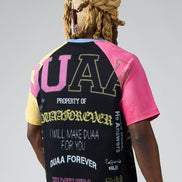 Person wearing a colorful t-shirt with text and graphics on a gray background