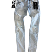 Blue distressed jeans with brand tags on a white background
