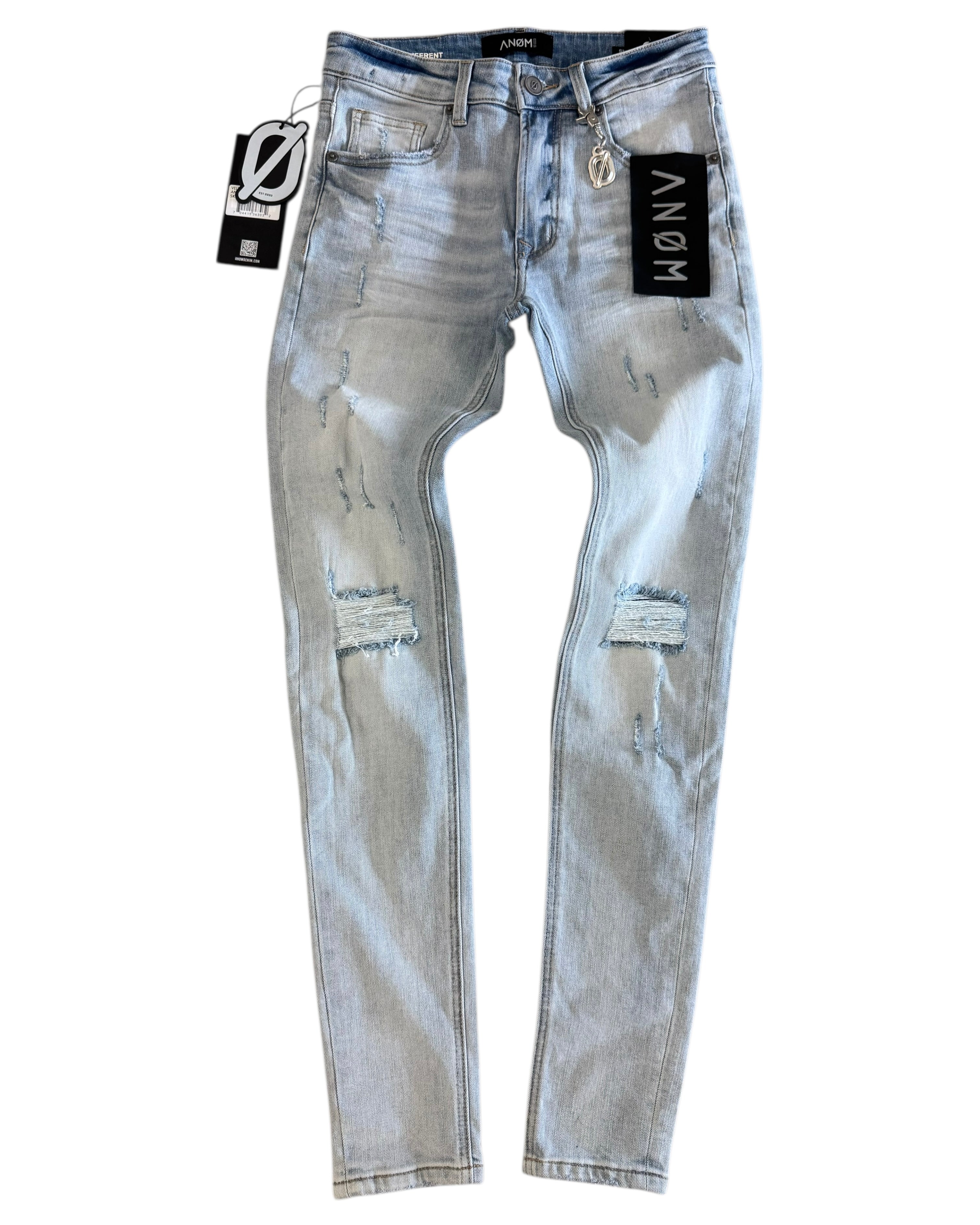 Blue distressed jeans with brand tags on a white background