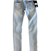 Light blue jeans with tags on a white background