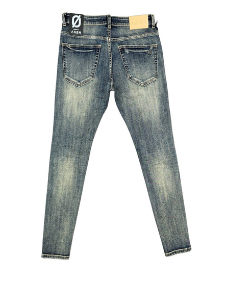 Blue jeans with a visible brand label on a white background