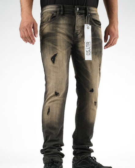 Distressed jeans with a brand tag on a white background