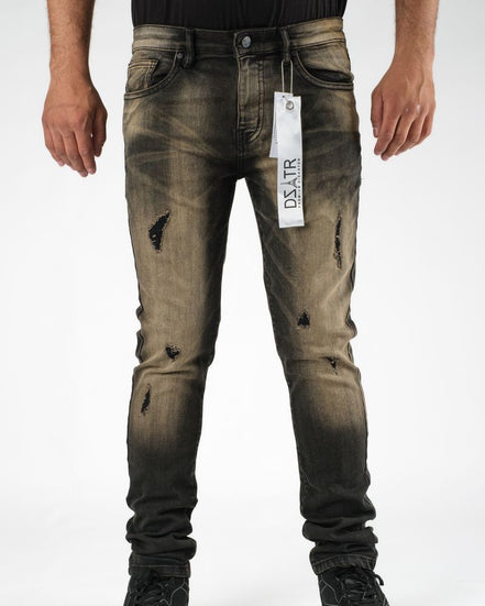 Distressed black jeans with a brand tag on a white background