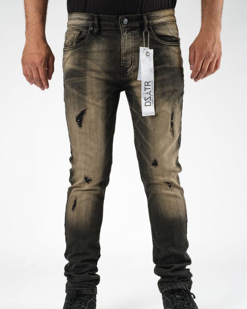 Distressed black jeans with a brand tag on a white background