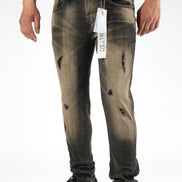 Distressed black jeans with a brand tag on a white background