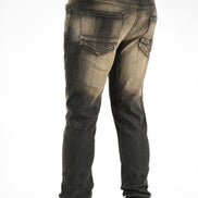Dark jeans worn by a person on a white background