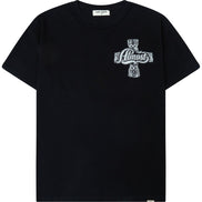 A black short-sleeve crewneck t-shirt featuring a white graphic print on the left chest depicting a cross with a skull and the text 'Almost God'.