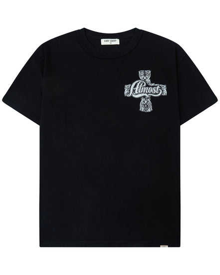 A black short-sleeve crewneck t-shirt featuring a white graphic print on the left chest depicting a cross with a skull and the text 'Almost God'.