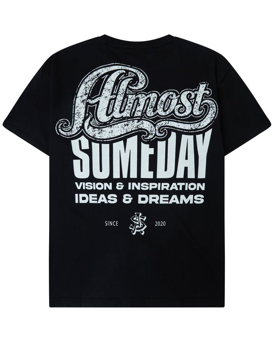 A black short-sleeve t-shirt shown from the back, featuring a large white graphic print that reads 'Almost Someday' with 'VISION & INSPIRATION IDEAS & DREAMS' underneath.