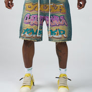 Person wearing denim shorts with colorful graphics and text, paired with yellow high-top sneakers on a white background.