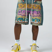 Person wearing colorful shorts with graffiti-style text and yellow sneakers on a white background