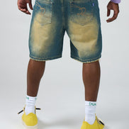 Person wearing blue denim shorts, yellow sneakers, and white socks with text on a white background