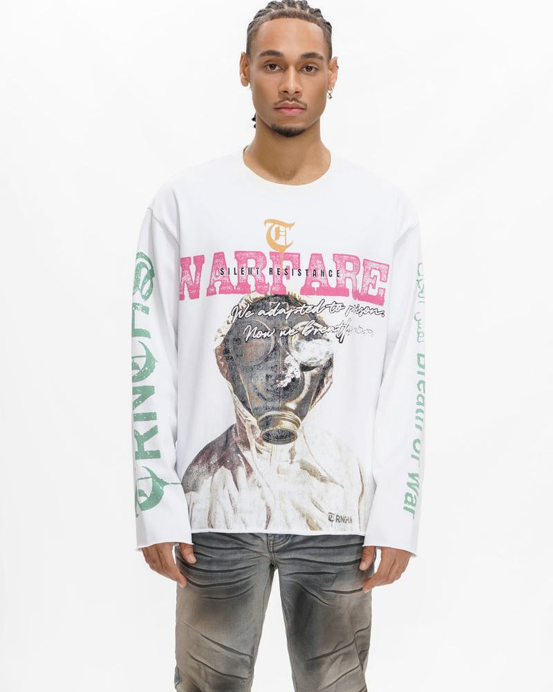 Man wearing a white long-sleeve shirt with graphic design and text on a white background