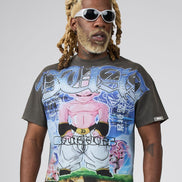 A man with blonde dreadlocks and sunglasses wearing a dark gray graphic t-shirt featuring a colorful Dragon Ball Z print of Majin Buu, set against a plain light gray background.