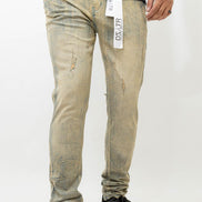 Person wearing light-colored distressed jeans with a visible brand tag on a white background
