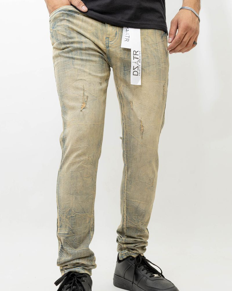 Person wearing light-colored distressed jeans with a visible brand tag on a white background